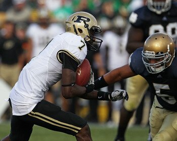 SOUTH BEND, IN - SEPTEMBER 04: Cortez Smith #7 of the Purdue Boilermakers moves for yardage as Manti Te'o #5 of the Notre Dame Fighting Irish closes in at Notre Dame Stadium on September 4, 2010 in South Bend, Indiana. Notre Dame defeated Purdue 23-12. (P
