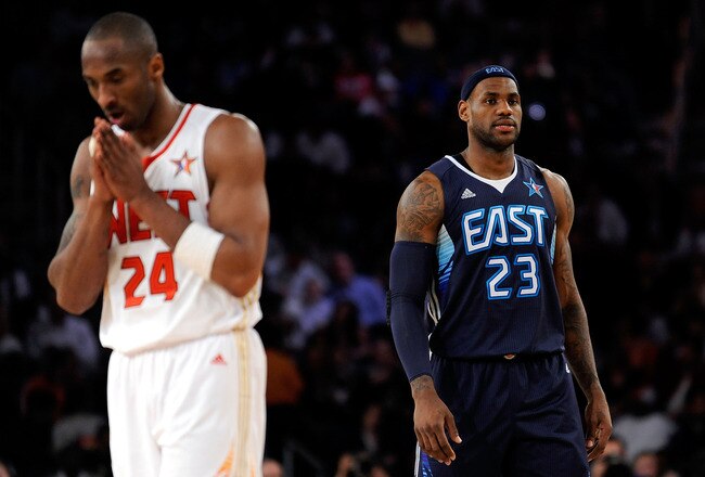 PHOENIX - FEBRUARY 15:  Kobe Bryant #24 of the Western Conference walks across the court in front of LeBron James #23 of the Eastern Conference during the 58th NBA All-Star Game, part of 2009 NBA All-Star Weekend at US Airways Center on February 15, 2009