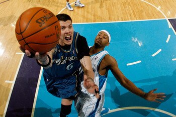 NEW ORLEANS - MARCH 31:  Mike Miller #6 of the Washington Wizards shoots the ball over Morris Peterson #24 of the New Orleans Hornets at New Orleans Arena on March 31, 2010 in New Orleans, Louisiana.  The Wizards defeated the Hornets 96-91.  NOTE TO USER: