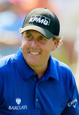ATLANTA - SEPTEMBER 23:  Phil Mickelson smiles as he walks off the eighth tee during the first round of THE TOUR Championship presented by Coca-Cola at East Lake Golf Club on September 23, 2010 in Atlanta, Georgia.  (Photo by Kevin C. Cox/Getty Images)