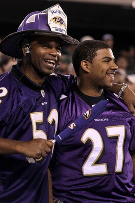 EAST RUTHERFORD, NJ - SEPTEMBER 13:  Fans of the Baltimore Ravens cheer during the game against the New York Jets at the New Meadowlands Stadium on September 13, 2010 in East Rutherford, New Jersey.  (Photo by Jim McIsaac/Getty Images)