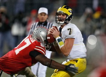 COLUMBUS, OH - NOVEMBER 18:  David Patterson #97 of the Ohio State Buckeyes hits quarterback Chad Henne #7 of the Michigan Wolverines November 18, 2006 at Ohio Stadium in Columbus, Ohio. Ohio State won 42-39.  (Photo by Gregory Shamus/Getty Images)