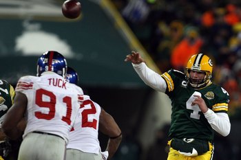 GREEN BAY, WI - JANUARY 20:  Quarterback Brett Favre #4 of the Green Bay Packers throws the ball during the NFC championship game against the New York Giants on January 20, 2008 at Lambeau Field in Green Bay, Wisconsin. The Giants defeated the Packers 23-