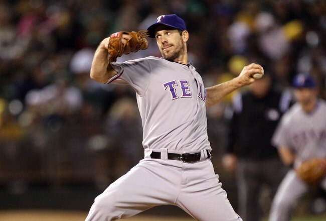 OAKLAND, CA - AUGUST 06:  Cliff Lee #33 of the Texas Rangers pitches against the Oakland Athletics at the Oakland-Alameda County Coliseum on August 6, 2010 in Oakland, California.  (Photo by Ezra Shaw/Getty Images)