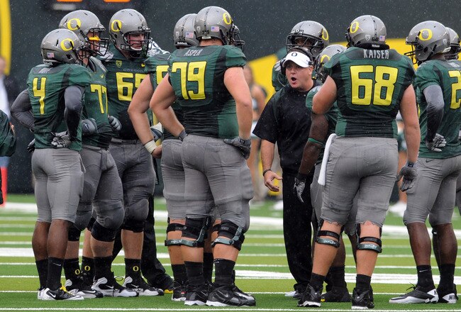 EUGENE, OR - SEPTEMBER 18: Head coach Chip Kelly of the Oregon Ducks has some words with his offensive unit during a time out in the second quarter of the game against the Portland State Vikings at Autzen Stadium on September 18, 2010 in Eugene, Oregon.