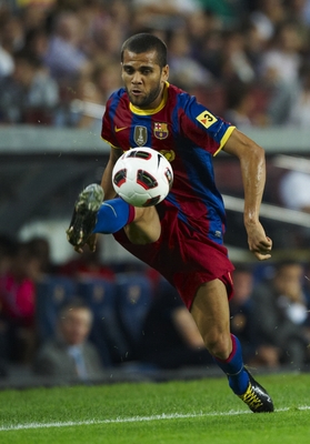 BARCELONA, SPAIN - SEPTEMBER 22:  Daniel Alves of Barcelona controls the ball during the La Liga match between Barcelona and Sporting de Gijon at Nou Camp on September 22, 2010 in Barcelona, Spain. Barcelona won 1.0.  (Photo by Manuel Queimadelos Alonso/G