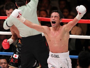 TOKYO - APRIL 30:  Fernando Montiel of Mexico celebrates after knocking out Hozumi Hasegawa of Japan during the WBC Bantamweight Title Fight between Hozumi Hasegawa and Fernando Montiel at Nippon Budokan on April 30, 2010 in Tokyo, Japan.  (Photo by Koich