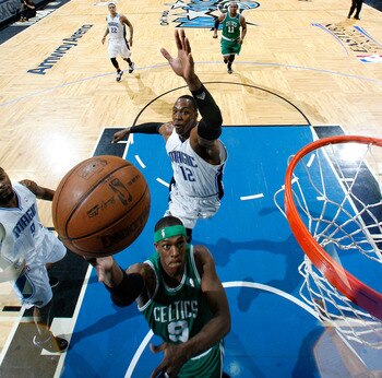 Dwight Howard comes in to foul Rondo on the layup