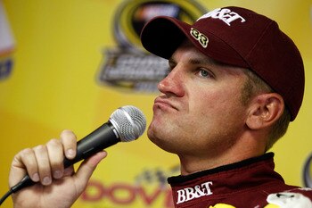 Clint Bowyer prepares to whine into a microphone.