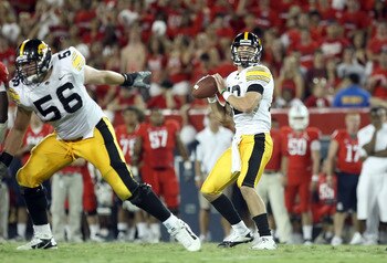 TUCSON, AZ - SEPTEMBER 18:  Quarterback Ricky Stanzi #12 of the Iowa Hawkeyes drops back to pass during the college football game against the Arizona Wildcats at Arizona Stadium on September 18, 2010 in Tucson, Arizona.  The Wildcats defeated the Hawkeyes