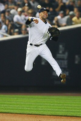 NEW YORK - SEPTEMBER 24:  Derek Jeter #2 of the New York Yankees fields a ball during a game against the Boston Red Sox on September 24, 2010 at Yankee Stadium in the Bronx borough of New York City.  (Photo by Andrew Burton/Getty Images)