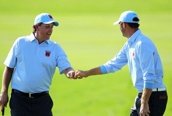 NEWPORT, WALES - SEPTEMBER 28:  Phil Mickelson of the USA (L) celebrates a putt with Dustin Johnson during a practice round prior to the 2010 Ryder Cup at the Celtic Manor Resort on September 28, 2010 in Newport, Wales.  (Photo by Andy Lyons/Getty Images)