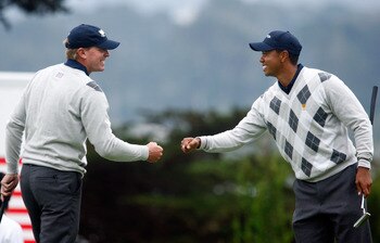 SAN FRANCISCO - OCTOBER 10:  Steve Stricker and Tiger Woods of the USA Team celebrate a birde to win the 12th hole during the Day Three Afternoon Fourball Matches of The Presidents Cup at Harding Park Golf Course on October 10, 2009 in San Francisco, Cali