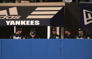 NEW YORK - OCTOBER 12:  Pitcher Mariano Rivera #42 of the New York Yankees is greeted by teammates after arriving to the Yankee bullpen in the fifth inning during game one of the American League Championship Series against the Boston Red Sox on October 12