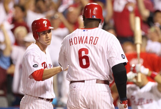 PHILADELPHIA - SEPTEMBER 25: First baseman Ryan Howard #6 of the Philadelphia Phillies is greeted at home plate by second baseman Chase Utley #26 after hitting a first inning two-run home run during a game against the New York Mets at Citizens Bank Park o