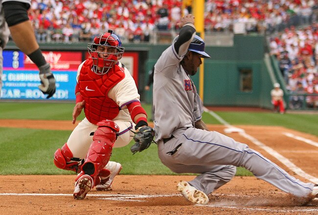 PHILADELPHIA - SEPTEMBER 26: Catcher Carlos Ruiz #51 of the Philadelphia Phillies tags out shortstop Jose Reyes #7 of the New York Mets at home plate during a game at Citizens Bank Park on September 26, 2010 in Philadelphia, Pennsylvania. (Photo by Hunter