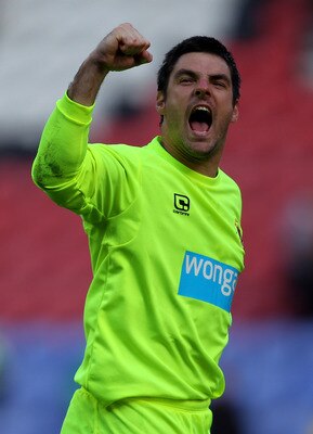 WIGAN, ENGLAND - AUGUST 14:  Matthew Gilks of Blackpool celebrates victory at the end of the Barclays Premier League match between Wigan Athletic and Blackpool at the DW Stadium on August 14, 2010 in Wigan, England.  (Photo by Alex Livesey/Getty Images)
