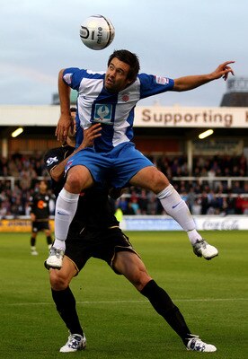 HARTLEPOOL, ENGLAND - AUGUST 24:  Adam Boyd of Hartlepool United rises above Antolin Alcaraz of Wigan Athletic during the Carling Cup second round match between Hartlepool United and Wigan Athletic at Victoria Park on August 24, 2010 in Hartlepool, Englan