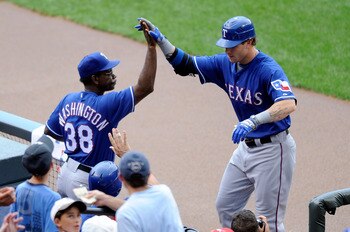 BALTIMORE - AUGUST 22:  Josh Hamilton #32 of the Texas Rangers is congratulated by manager Ron Washington after hitting a home run in the first inning against the Baltimore Orioles at Camden Yards on August 22, 2010 in Baltimore, Maryland.  (Photo by Greg