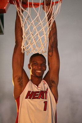 Bosh can't really do that to a ten foot rim without jumping