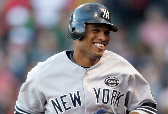 BOSTON - OCTOBER 2:  Robinson Cano #24 of the New York Yankees smiles after hitting a solo home run in the third inning during the first game of a doubleheader against the Boston Red Sox at Fenway Park October 2, 2010 in Boston, Massachusetts. (Photo by J