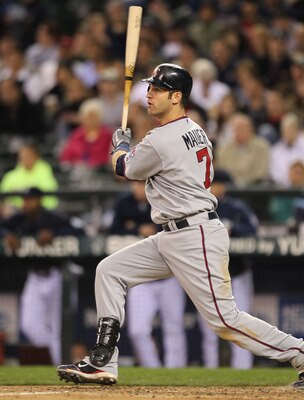 SEATTLE - AUGUST 27:  Joe Mauer #7 of the Minnesota Twins bats against the Seattle Mariners at Safeco Field on August 27, 2010 in Seattle, Washington. The Twins won 6-3. (Photo by Otto Greule Jr/Getty Images)
