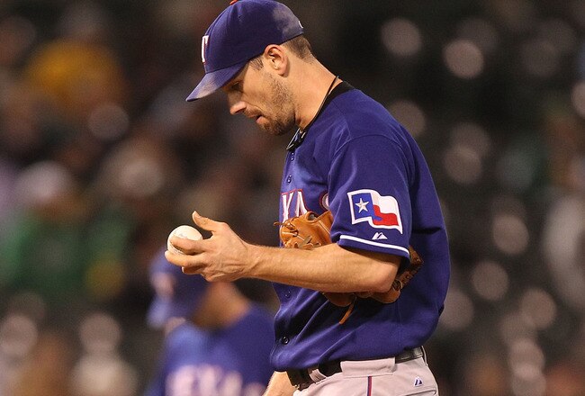 OAKLAND, CA - SEPTEMBER 23:  Cliff Lee #33 of the Texas Rangers looks on after giving up two runs to the Oakland Athletics in the fifth inning during a Major League Baseball game at the Oakland-Alameda County Coliseum on September 23, 2010 in Oakland, Cal