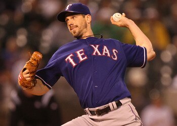 OAKLAND, CA - SEPTEMBER 23:  Cliff Lee #33 of the Texas Rangers pitches against the Oakland Athletics during a Major League Baseball game at the Oakland-Alameda County Coliseum on September 23, 2010 in Oakland, California.  (Photo by Jed Jacobsohn/Getty I