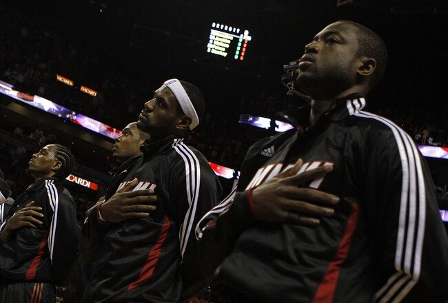 MIAMI - OCTOBER 05:  Forward LeBron James #6 (C) and teammate Dwyane Wade #3 (R) on the court before taking on the Detroit Pistons on October 5, 2010 in Miami, Florida.  NOTE TO USER: User expressly acknowledges and agrees that, by downloading and or usin