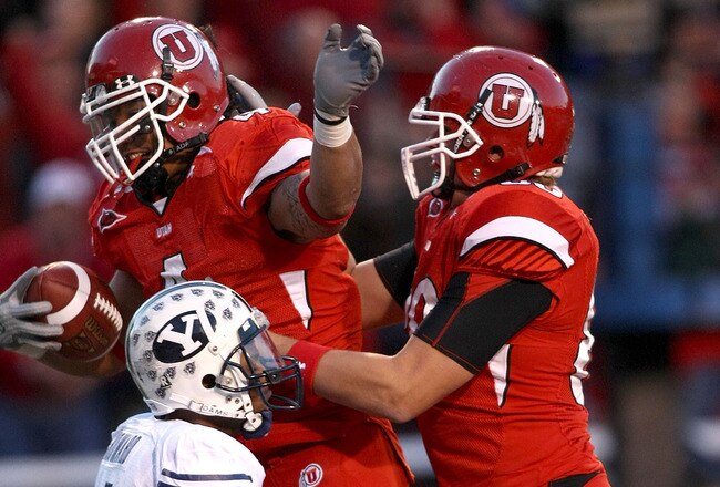 SALT LAKE CITY - NOVEMBER 22:    Matt Asiata #4 of the Utah Utes celebrates with Chris Joppru #80 after scoring a touchdown against the BYU Cougars at Rice-Eccles Stadium on November 22, 2008 in Salt Lake City, Utah.  (Photo by Jonathan Ferrey/Getty Image