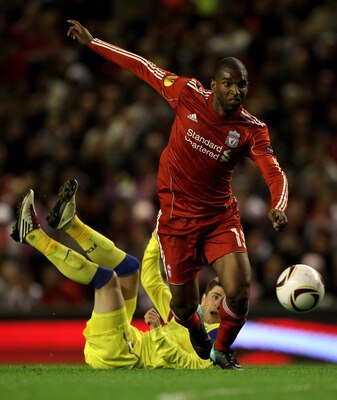 LIVERPOOL, ENGLAND - SEPTEMBER 16 :  Ryan Babel of Liverpool goes past Mihai Radut of Steaua Bucharest during the UEFA Europa League Group K match beteween Liverpool and Steaua Bucharest at Anfield on September 16, 2010 in Liverpool, England.  (Photo by A