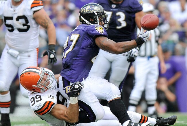 BALTIMORE - SEPTEMBER 26:  Ray Rice #27 of the Baltimore Ravens can't hold onto a pass as he's taken down by Scott Fujita #99 of the Cleveland Browns  at M&T Bank Stadium on September 26, 2010 in Baltimore, Maryland. The Ravens defeated the Browns 24-17.