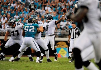 JACKSONVILLE, FL - SEPTEMBER 26:  Quarterback Michael Vick #7 of the Philadelphia Eagles throws a touchdown pass to wide receiver Jeremy Maclin #18 against the Jacksonville Jaguars at EverBank Field on September 26, 2010 in Jacksonville, Florida. The Eagl