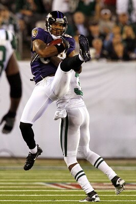 EAST RUTHERFORD, NJ - SEPTEMBER 13:  T.J. Houshmandzadeh #84 of the Baltimore Ravens catches a pass against the New York Jets during their home opener at the New Meadowlands Stadium on September 13, 2010 in East Rutherford, New Jersey.  (Photo by Jim McIs