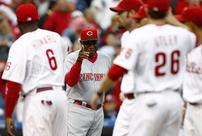 PHILADELPHIA - OCTOBER 06:  Dusty Baker #12, manager of the Cincinnati Reds waves to Ryan Howard #6 of the Philadelphia Phillies before Game 1 of the  NLDS at Citizens Bank Park on October 6, 2010 in Philadelphia, Pennsylvania.  (Photo by Jeff Zelevansky/