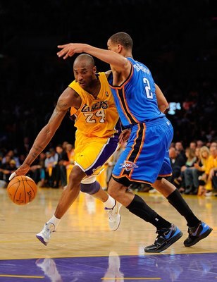 LOS ANGELES, CA - APRIL 27:  Kobe Bryant #24 of the Los Angeles Lakers drives on Thabo Sefolosha #2 of the Oklahoma City Thunder during Game Five of the Western Conference Quarterfinals of the 2010 NBA Playoffs at Staples Center on April 27, 2010 in Los A