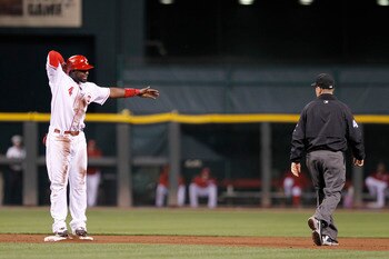 CINCINNATI, OH - SEPTEMBER 28: Brandon Phillips #4 of the Cincinnati Reds argues with second base umpire Jerry Meals after being called out against the Houston Astros at Great American Ball Park on September 28, 2010 in Cincinnati, Ohio. The Reds won 3-2