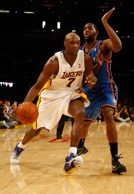 LOS ANGELES, CA - NOVEMBER 22:  Lamar Odom #7 of the Los Angeles Lakers drives to the basket past D.J. White #3 of the Oklahoma City Thunder in the second half at Staples Center on November 22, 2009 in Los Angeles, California. The Lakers defeated the Thun