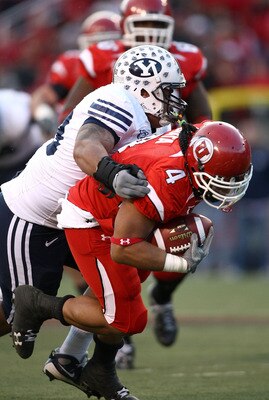 SALT LAKE CITY - NOVEMBER 22:  Matt Asiata #4 of the Utah Utes runs with the ball against the BYU Cougars at Rice-Eccles Stadium on November 22, 2008 in Salt Lake City, Utah.  (Photo by Jonathan Ferrey/Getty Images)