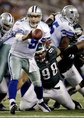 ARLINGTON, TX - JANUARY 9:  Tony Romo #9 of the Dallas Cowboys pitches the ball in the fourth quarter against the Philadelphia Eagles during the 2010 NFC wild-card playoff game at Cowboys Stadium on January 9, 2010 in Arlington, Texas. (Photo by Jamie Squ