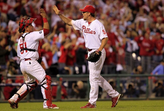 PHILADELPHIA - OCTOBER 08:  Carlos Ruiz #51 and Brad Lidge #54 of the Philadelphia Phillies celebrate a victory over the Cincinnati Reds in game 2 of NLDS at Citizens Bank Park on October 8, 2010 in Philadelphia, Pennsylvania. The Phillies defeated the Re