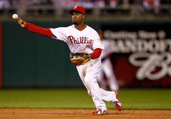 PHILADELPHIA - OCTOBER 06:  Jimmy Rollins #11 of the Philadelphia Phillies throws to first in Game 1 of the NLDS against the Cincinnati Reds at Citizens Bank Park on October 6, 2010 in Philadelphia, Pennsylvania.  (Photo by Jeff Zelevansky/Getty Images)