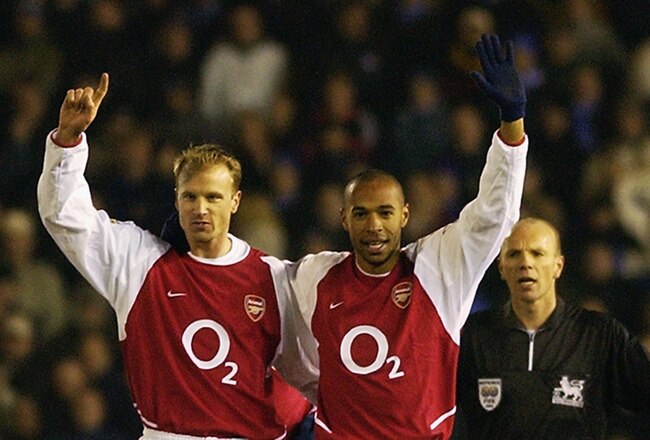 BIRMINGHAM - JANUARY 12:  Thierry Henry of Arsenal celebrates scoring his 100th goal for Arsenal with Dennis Bergkamp of Arsenal during the FA Barclaycard Premiership match between Birmingham City and Arsenal held on January 12, 2003 at St Andrews in Birm