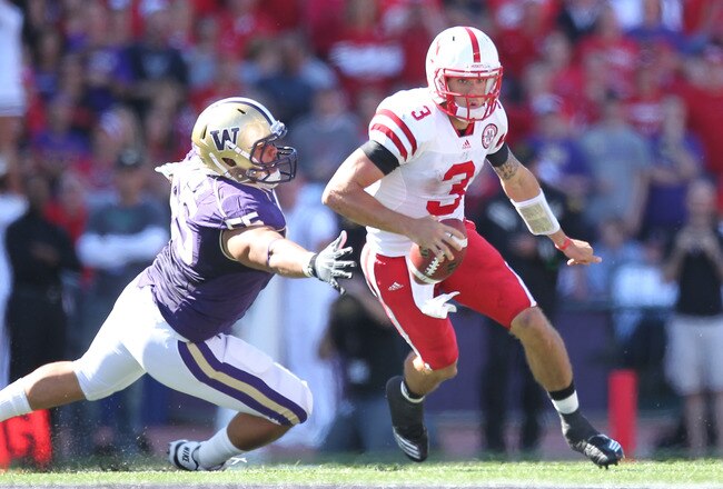 SEATTLE - SEPTEMBER 18: Quarterback Taylor Martinez #3 of the Nebraska Cornhuskers rushes against Sione Potoa'e #55 of the Washington Huskies on September 18, 2010 at Husky Stadium in Seattle, Washington. (Photo by Otto Greule Jr/Getty Images)