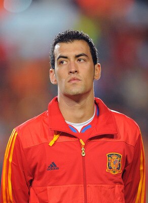 SALAMANCA, SPAIN - OCTOBER 08: Sergio Busquets  of Spain listens to his country's national anthem before the the EURO 2012 Qualifying Group I match between Spain and Lithuania at the Helmantico stadium on October 8, 2010 in Salamanca, Spain.  (Photo by De