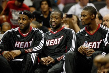 SAN ANTONIO - OCTOBER 09:  LeBron James #6, Dwayne Wade #3, and Chris Bosh #1 of the Miami Heat sit on the bench during the game against the San Antonio Spurs at the AT&T Center on October 9, 2010 in San Antonio, Texas.  NOTE TO USER: User expressly ackno