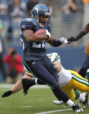 SEATTLE - AUGUST 21:  Josh Wilson #26 of the Seattle Seahawks returns a kick during the preseason game against the Green Bay Packers at Qwest Field on August 21, 2010 in Seattle, Washington. (Photo by Otto Greule Jr/Getty Images)