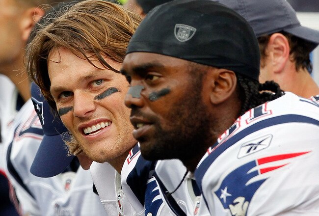 FOXBORO, MA - SEPTEMBER 12: Quarterback Tom Brady #12 and Randy Moss #81 of the New England Patriots take a breather on the bench during the NFL season opener against the Cincinnati Bengals at Gillette Stadium on September 12, 2010 in Foxboro, Massachuset