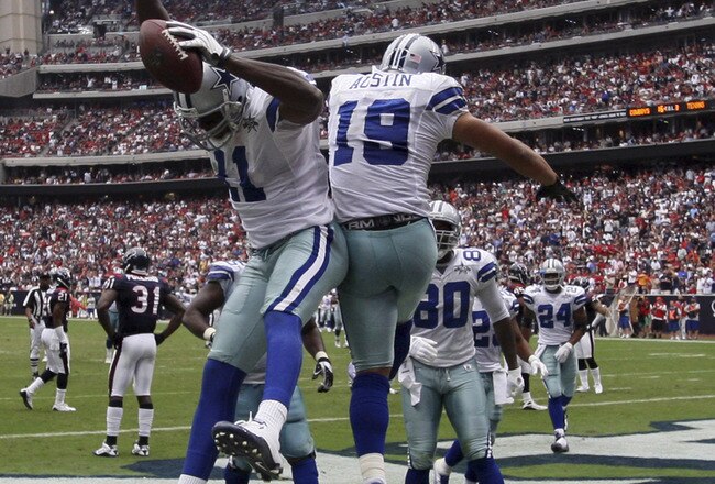 HOUSTON - SEPTEMBER 26:  Wide receiver Roy Williams #11 and Miles Austin #11 celebrate after scoring on a 15 yard pass from Tony Romo in the third quarter at Reliant Stadium on September 26, 2010 in Houston, Texas.  (Photo by Bob Levey/Getty Images)