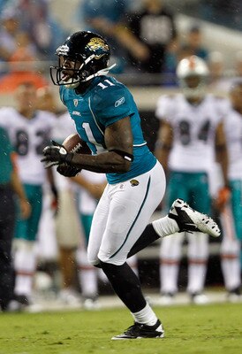JACKSONVILLE, FL - AUGUST 21:  Mike Sims-Walker #11 of the Jacksonville Jaguars runs after making a reception during the preseason game against the Miami Dolphins at EverBank Field on August 21, 2010 in Jacksonville, Florida.  (Photo by Sam Greenwood/Gett